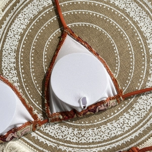Detail of crochet bikini top showing breathable white lining and removable pads