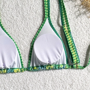 Detail view of floral bikini top with removable round pads and white breathable lining