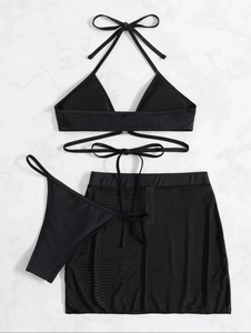 Three-piece black bikini set with lace-up top, thong bottom and mesh skirt cover-up