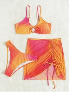 Detailed view of 3-piece ombre pink gradient bikini set with drawstring beach skirt