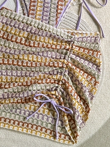 Detail view of multicolored crochet bikini set with wave pattern and halter ties