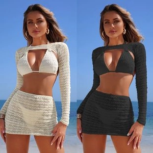 Detailed close-up of three-piece knit bikini set featuring hollow wavy crochet texture
