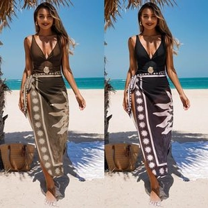 Detail of printed wrap maxi skirt and bikini top set in olive green and black