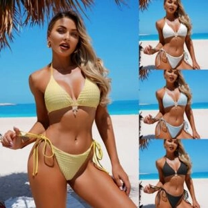 Detail of waffle textured bikini set with seashell pendant in multiple colors on beach
