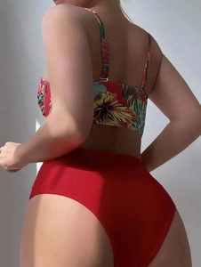 Detail view of tropical floral print bikini top with adjustable straps and high-waist bottom