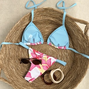 Close-up of two-piece bikini with floral print showing S size label and fabric composition