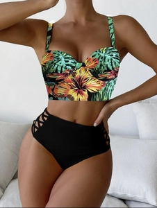 Detail of high-waisted bikini bottoms with lattice cut-out side detailing for women