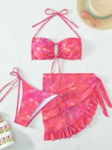 Three-piece pink tie-dye bikini set with halter top and matching ruffle sarong skirt