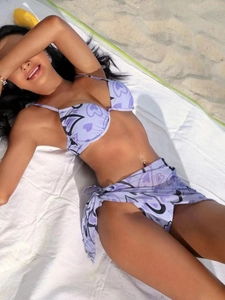 Three-piece purple heart print bikini set with underwire top and mesh beach sarong
