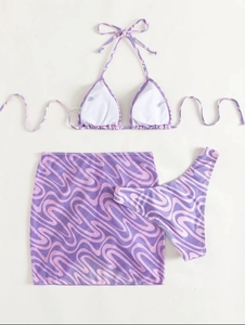 Three-piece purple swirl bikini set including halter top, bottom, and mesh skirt