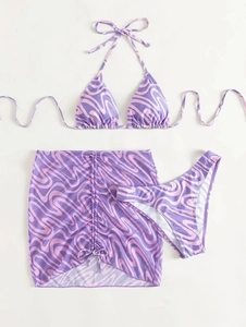 Three-piece bikini set featuring wave print top, bottom, and drawstring mini skirt