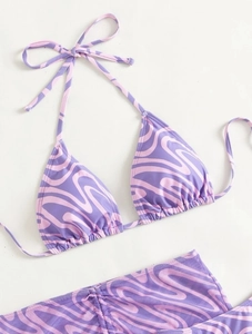 Detail view of purple wave print bikini top with adjustable neck and back ties