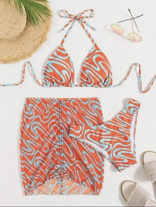 Three-piece bikini set with psychedelic swirl print including top, bottom and beach skirt