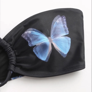 Sexy black bikini top featuring a vivid blue butterfly print with sleek elastic fabric