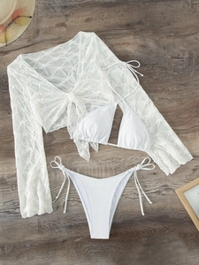 Three-piece white bikini set with high-cut briefs and textured long-sleeve mesh cover-up