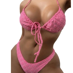 Pink two-piece bikini set with floral texture and halter neck tie design
