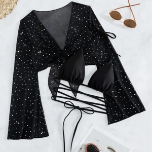 Three-piece black bikini set with sheer star print mesh top and long waist ties