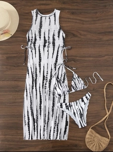 Detailed flat lay of a 3-piece tiger print bikini set with a sheer mesh beach maxi dress