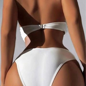 Two-piece white strapless bikini with metallic back buckle closure shown from the back