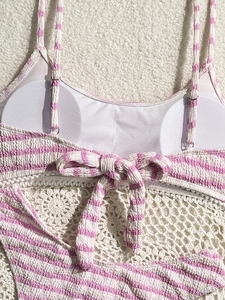 Detail of pink striped seersucker bikini with adjustable straps and bow tie back design