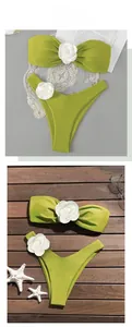 Detail of lime green bikini top featuring a 3D white rose on smooth swimwear fabric