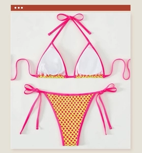 Detail of fuchsia halter bikini top with removable pads and yellow mesh high-waist bottoms