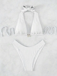 Detail of ribbed white halter bikini with golden starfish and seashell charms