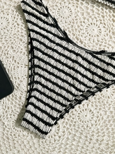 Women's sexy black and white striped smocked bikini bottoms for beach vacation styling