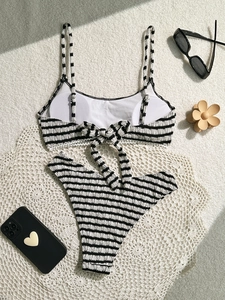 Chic black and white striped bikini set with seersucker texture and tie back detailing