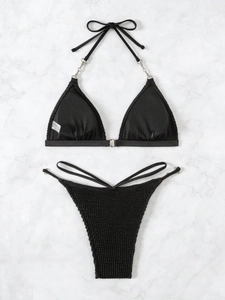 Women's black halter neck bikini set with silver chain details and waffle texture