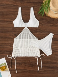 Three-piece white knit bikini set with buckled top and mesh drawstring cover-up skirt