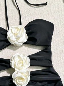 Sexy black one-piece swimsuit featuring three 3D white fabric camellia flowers and halter neck