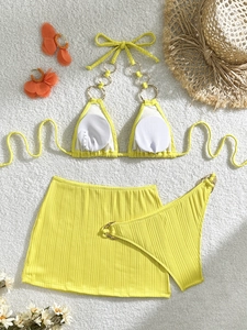 Three-piece lemon yellow ribbed bikini set with gold ring detail and matching skirt