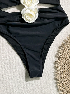 Sexy black high-waisted bikini bottoms featuring two white 3D floral accents for beachwear