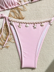 Pink ribbed bikini bottom with white crochet lace and delicate shell star charms