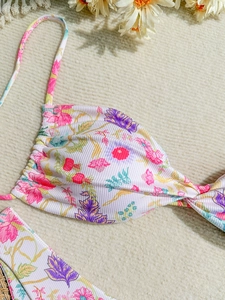 Detailed close-up of floral print ribbed fabric for women's two-piece bikini swimwear