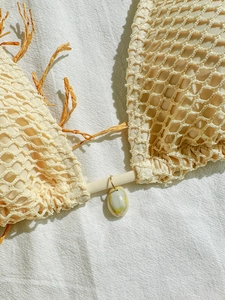 Bohemian crochet bikini top with raffia fringe and natural shell detail in beige