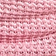 Close-up detail of the pink chunky knit fabric showing rich texture and woven patterns