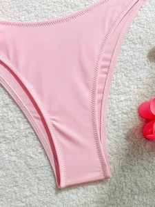 Pink push-up bikini bottom with floral design and precision zig-zag stitching detail
