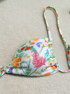 Floral print ribbed bikini top with adjustable spaghetti straps and vibrant leaf pattern