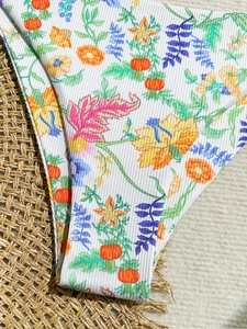 Women's floral ribbed bikini bottom with tropical leaf print on white fabric