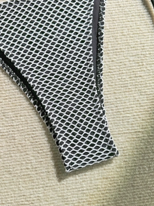 Detailed close-up showing the dual-layer mesh fabric and fine stitching of the bikini
