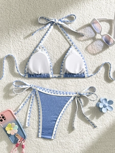 Sky blue two-piece bikini set with textured seersucker fabric and wave trim
