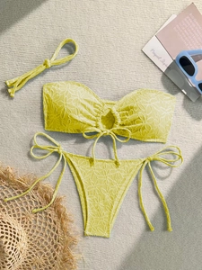 Detail of yellow bikini with daisy floral embroidery and matching headband