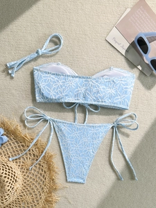 Two-piece light blue bikini with floral embroidery texture and side-tie bottoms