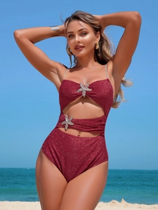 Sexy glitter dark red cutout bikini swimsuit with metal starfish detail and beach background