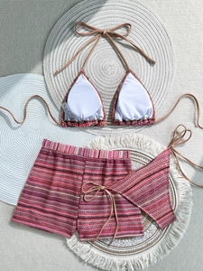 Macro detail of three-piece crochet bikini set with colorful horizontal stripes