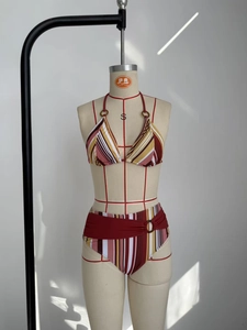 Detailed view of striped bikini set featuring circular ring buckles and side-tie briefs