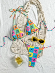 Colorful eye print checkered bikini set with halter top and beach accessories