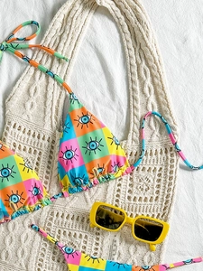 Printed bikini set with evil eye pattern and side-tie bottoms for summer beach vacation